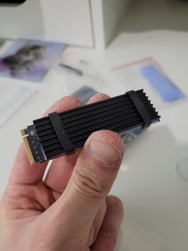 An M.2 PCIE4 SSD with a third party heatsink attached to it