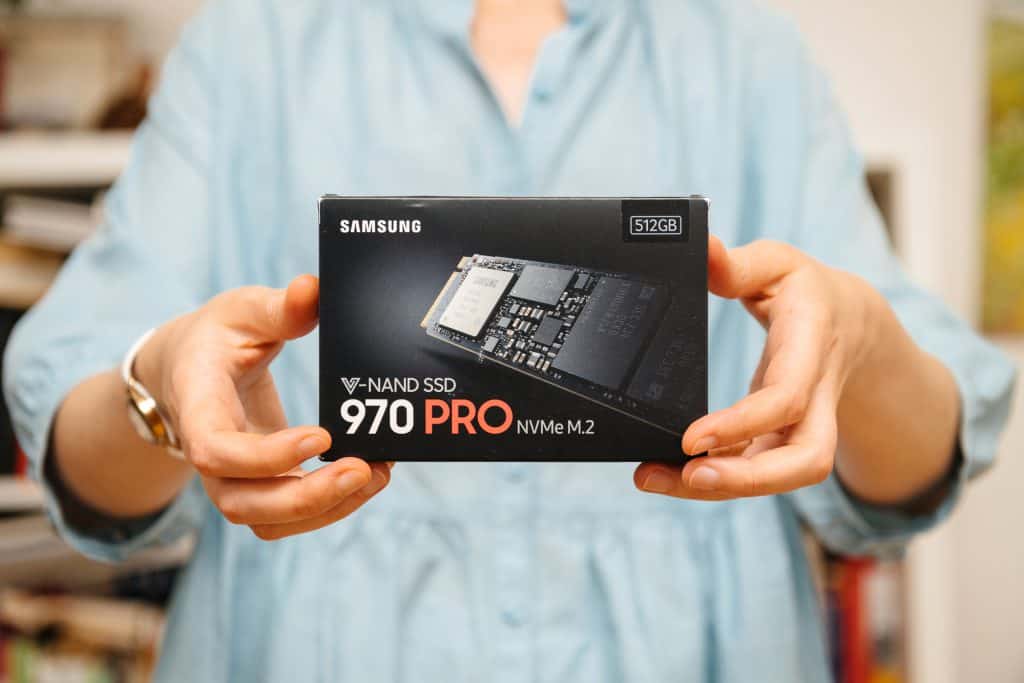 Someone holding an M.2 SSD Samsung 970 Pro drive