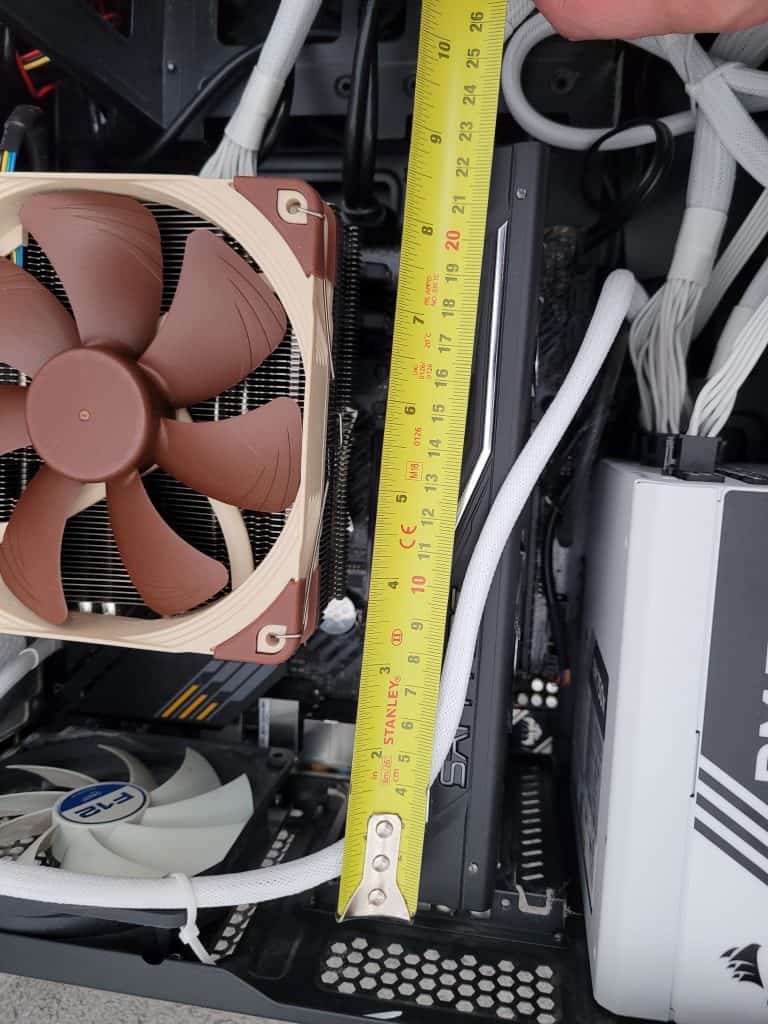 Me measuring up available GPU space inside my mini ATX case