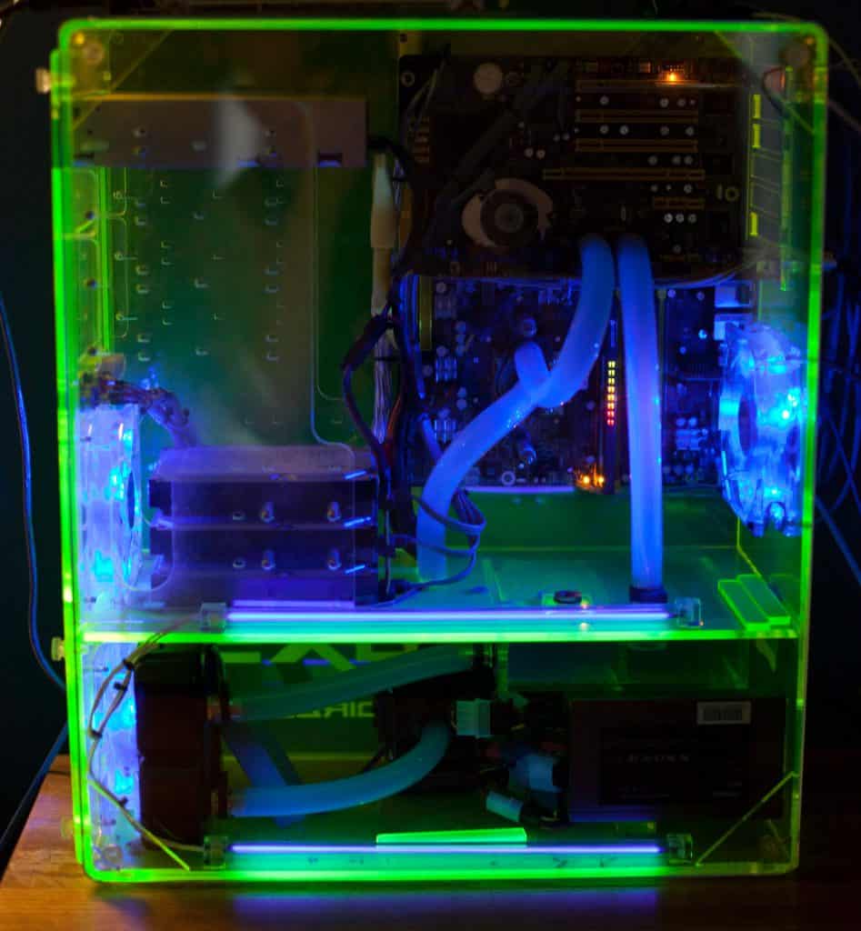 Transparent computer with liquid cooling and UV lighting effects