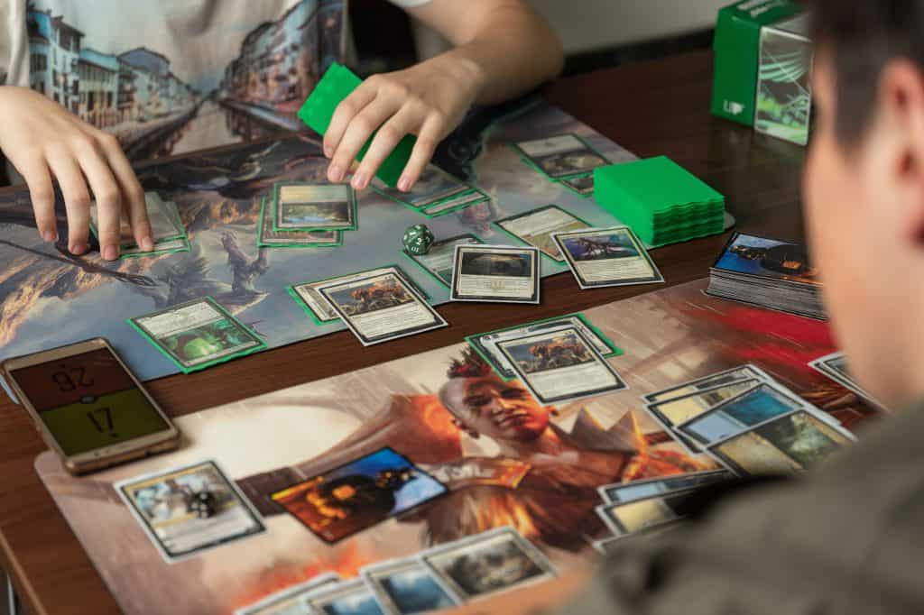 Two people playing Magic The Gathering in a gaming club