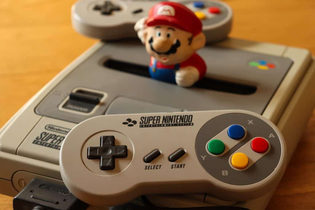 Close up shot of a SNES with Super Mario poking out too