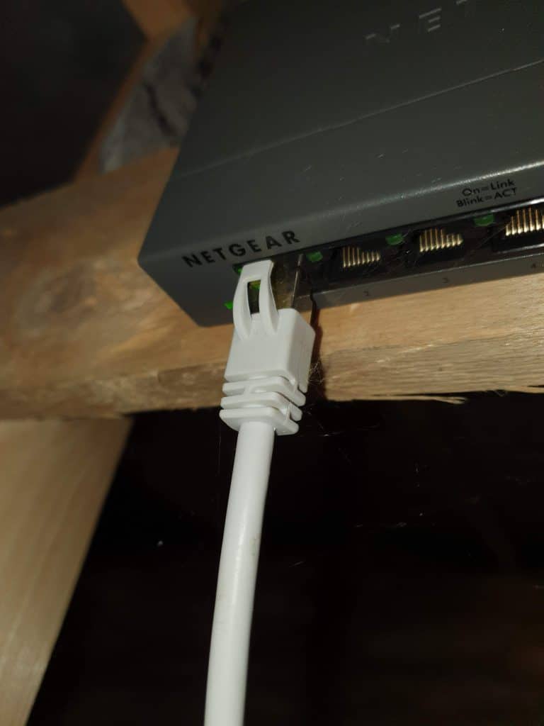 An Ethernet cable plugged into my network switch