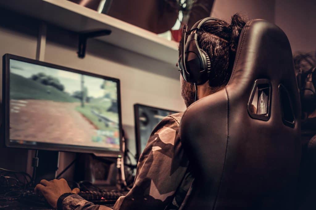 A PC gamer with a nice gaming chair and headset