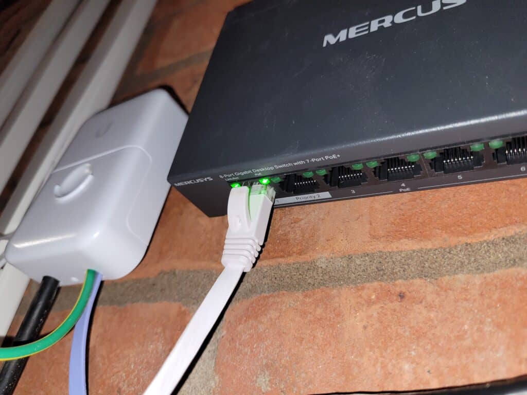 A close up shot of a PoE port showing that both data and power are being sent out