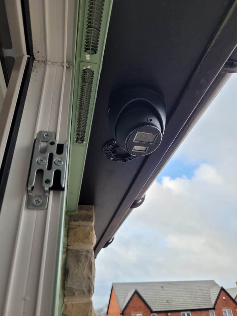An ANNKE PoE camera installed on soffit