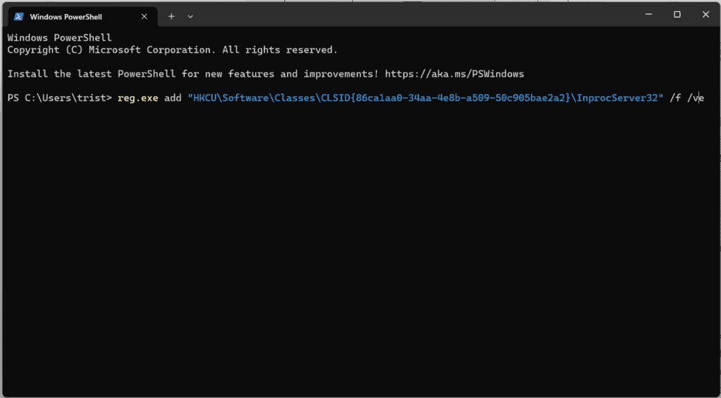 Pasting the regedit command into Windows Terminal to restore the legacy context menu
